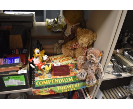 A vintage compendium of games,a Steiff bear, doll and similar.