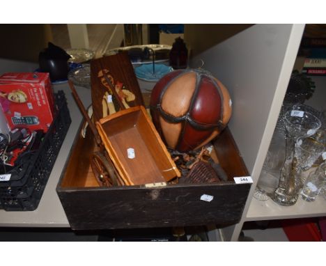 A vintage wooden box containing a wooden cart,hot air balloon decoration and similar.