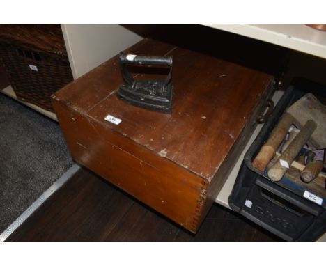 A vintage tool chest containing a selection of items including planes,saws,sharpening stone and more.
