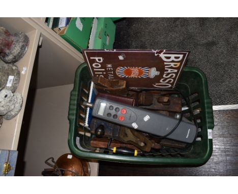 A variety of vintage woodworking planes a reproduction Brasso sign and a Raymarine ST1000.