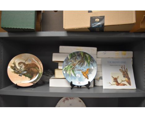 A selection of ceramic display plates having nature scenes by Wedgwood