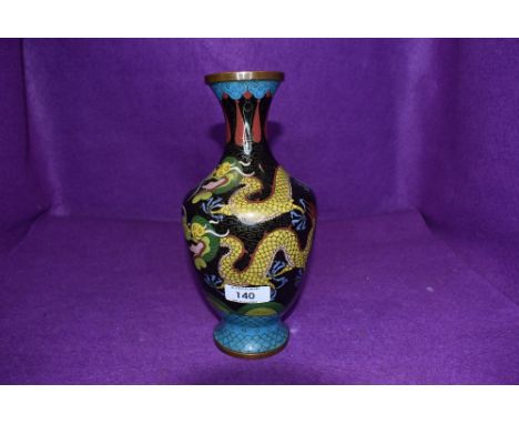 A vintage cloisonne vase being decorated with mythical Japanese dragon
Good condition