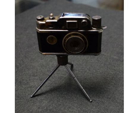 A KKW Camera tabletop lighter, with compass