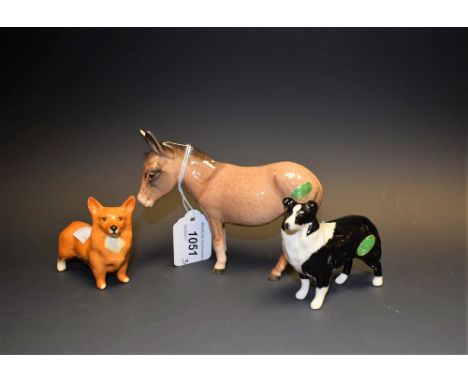 A Beswick model, of a Donkey, printed marks; others Corgi and Collie dogs (3)