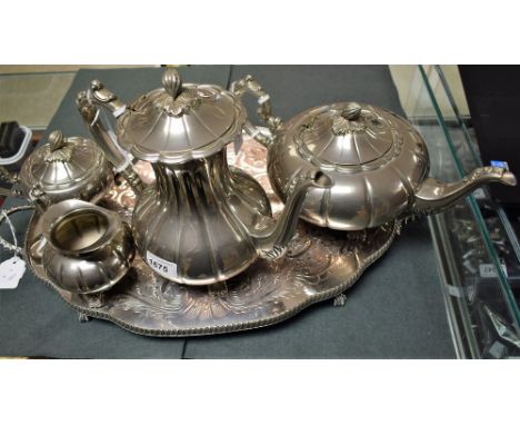 A silver plated pumpkin design tea set, comprising teapot, coffee/hot water pot, sucrier and milk jug, on associated tray