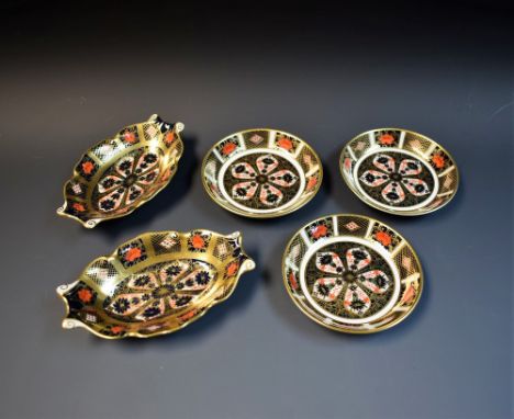 Royal Crown Derby - a trio of circular trinket dishes; a pair of oval boat trinket dishes, part seconds (5) 