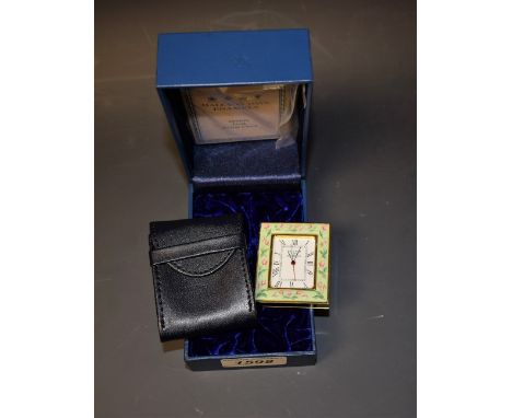 A Halcyon Days enamel desk alarm clock, with box and papers