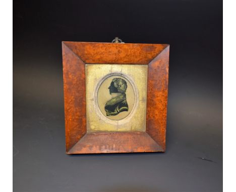 An early 19th century portrait silhouette picked out in gold, a gent in uniform, Samuel Dodson, born about 1810, titled to ve