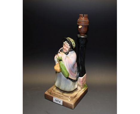 An unusual Bretby Art Pottery figural table lamp, Charles Dickens' Sairey Gamp, modelled as a curmudgeonly old lady in bonnet