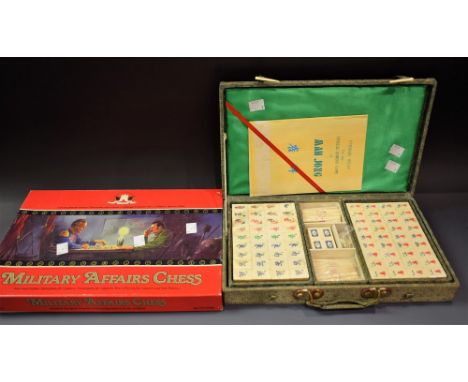 A Scarce Military Affairs chess set, boxed, instructions, good condition; a boxed Mah Jong set (2)