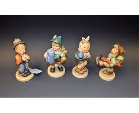 A collection of four Goebel Hummel figures