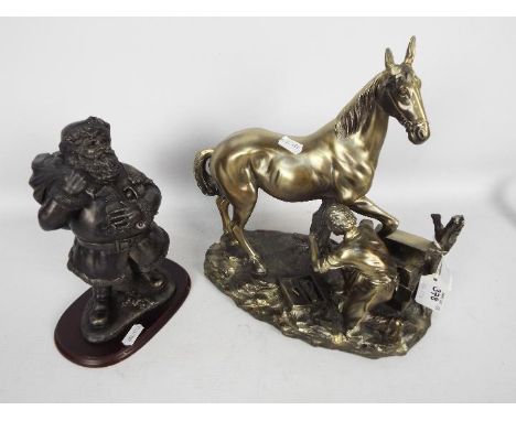 A cold cast bronze from the Leonardo Collection depicting Santa Claus and one other of a farrier at work, largest approximate