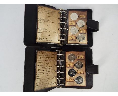 Two Harry Potter coin collections, each contained in Gringotts Savings Book wallet. [2]Condition Report: There are 28 coins i