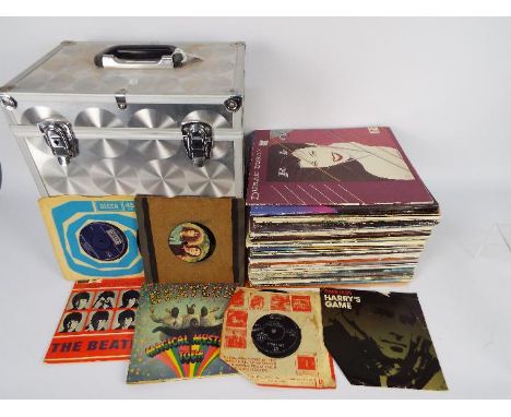 A carry case of vinyl records, predominantly 12", to include The Beatles, Fleetwood Mac, Duran Duran, Electric Light Orchestr