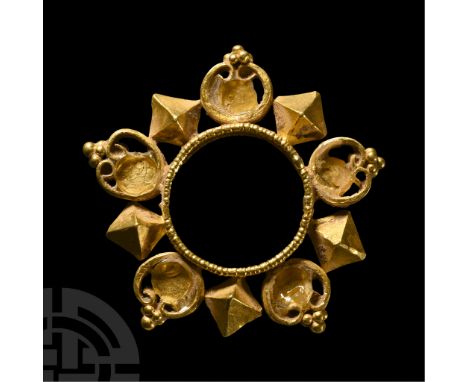 3rd-7th century A.D. With applied heart-shaped openwork panels and octahedrons on the outer face of a decorative ring band. S