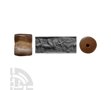 Circa 2nd-1st millennium B.C. The frieze depicting a leaping winged ibex followed by a small bird in flight, behind the ibex 