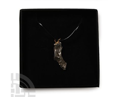 Fell 6000-5000 years B.P. Comprising a section of nickel-iron meteorite (IAB) set with a suspension loop and suspended from a