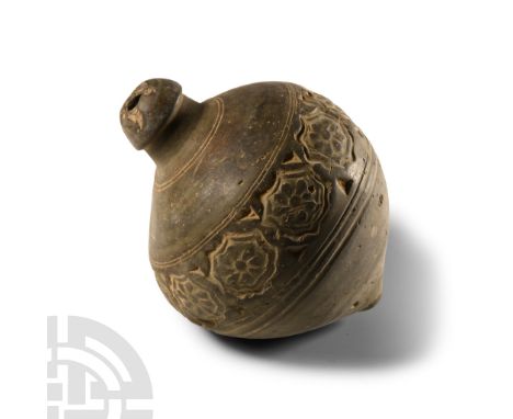 9th-11th century A.D. Piriform body with band of impressed rosettes to the equator, domed filler-hole, intended to be filled 
