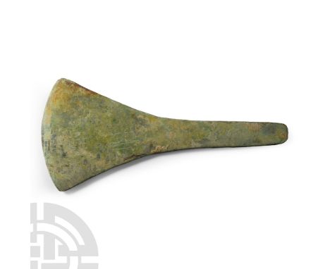 Circa 13th-7th century B.C. Formed with a squared butt and flared cutting edge; flat in cross-section. Cf. Evans, J., The Anc