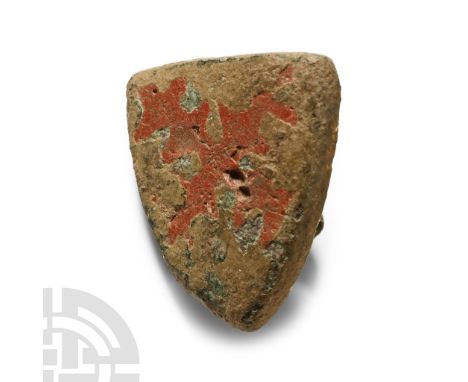 14th-15th century A.D. Heater-shaped plaque with stud to the reverse; inlaid enamel saltire engrailed.  6 grams, 17 mm (5/8 i