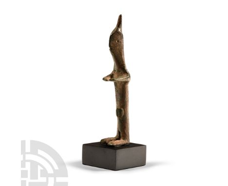 Circa 6th century B.C. Modelled in the round figure standing nude, the arms stretched out to the front, flat pinched head wit