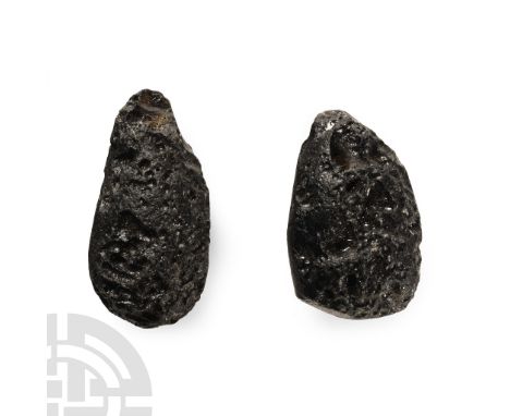 Found circa 2010 A.D. Black tektite pair formed from the impact of a meteorite.  30 grams total, 33-37 mm (1 1/4 - 1 1/2 in.)