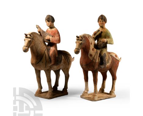 Tang Dynasty, 618-907 A.D. Two mounted musicians comprising: the horse standing on a rectangular base with painted harness, b