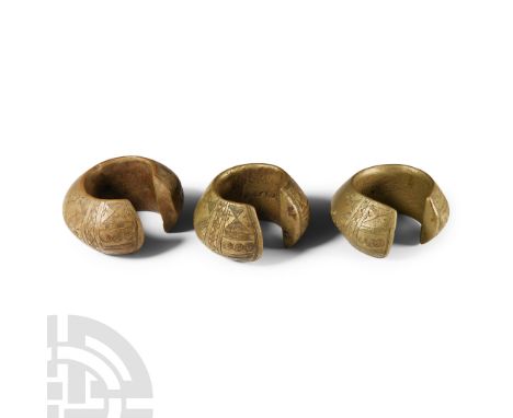 19th century A.D. Group of three 'African Slave Trade' currency bracelets each penannular in plan and biconvex in profile wit