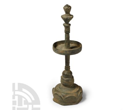 Circa 13th century A.D. With tiered lotus-flower base and balustered stem, a plain cup with raised rims to the centre of the 