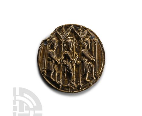 Southern Germany, circa 1300 A.D. Disc with beaded border, repoussé scene with lancet-arch arcade, nimbate Christ being beate