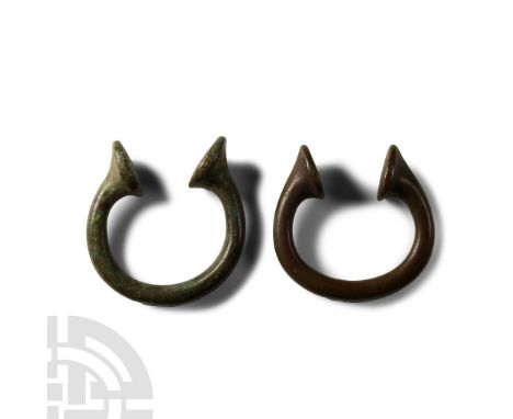 19th century A.D. Group of two penannular round-section bracelets with clubbed ends.  155 grams total, 57 mm each (2 1/4 in.)