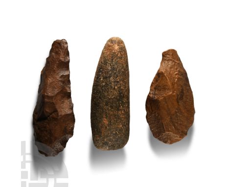Palaeolithic-Neolithic Period, circa 200,000-4000 B.P. Comprising: two teardrop-shaped handaxes, one with absent tip; a pecke