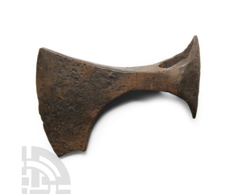 9th-11th century A.D. With short curved blade and spur beneath the chin, narrow neck, deep socket with extended edges to the 