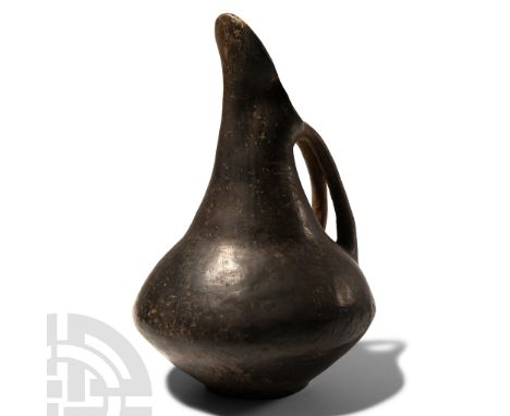 Circa 8th century B.C. Three-lobed mouth with elongated beak, truncated-conical neck, shoulder with a convex profile, biconic