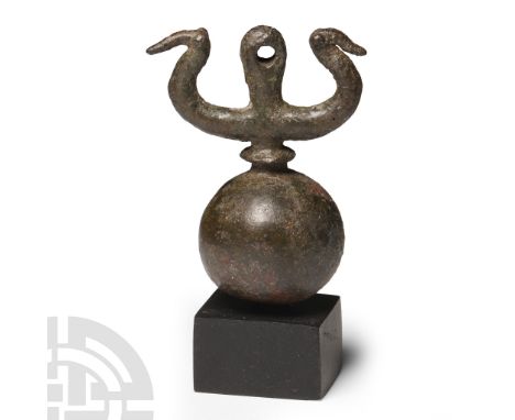 Circa 8th-7th century B.C. Comprising a spherical body with biconvex collar, lateral arms ending in stylised bird-heads, pier