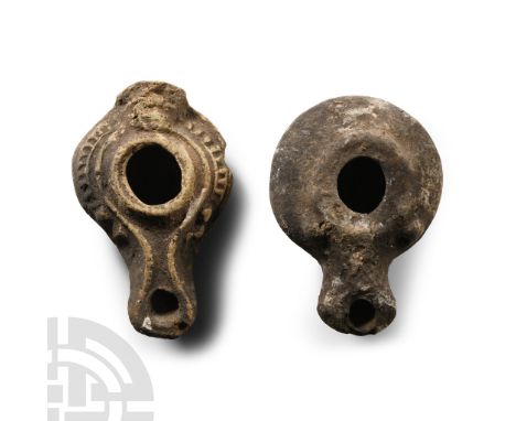 1st-2nd century A.D. Each with broad squat body, raised rim to the discus, extended nozzle and basal ring.  167 grams total, 