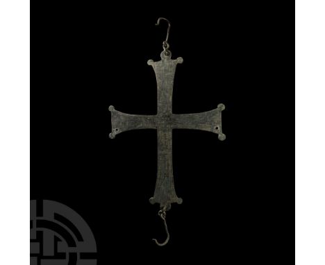 Circa 8th-10th century A.D. Substantial cross pattée with pierced lobes to the vertical arms, each end provided with a link a
