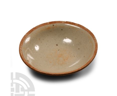 Tang Dynasty, 618-907 A.D. or later. Of low ogee profile with unglazed rim, basal ring.  170 grams, 14.5 cm wide (5 3/4 in.).