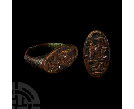 New Kingdom, 19th Dynasty, 1303-1213 B.C. D-shaped hoop and ellipsoid plaque, hieroglyphic text in low relief giving the regn