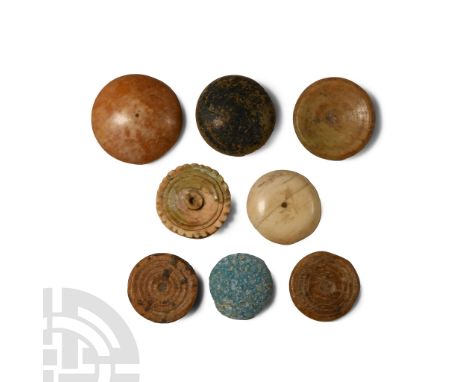 1st century A.D. and later. Comprising plano-convex, discoid and other types in bone and glass.  20 grams total, 17-23 mm (5/