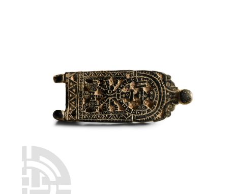 7th-8th century A.D. Tongue-shaped with an applied openwork panel, cross-in-wheel motif within a segmented border and zoomorp