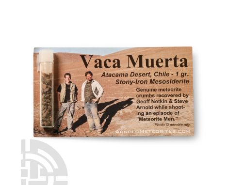 Found circa 2010 A.D. Meteorite crumbs in a glass phial from Vaca Muerta in the Atacama Desert.  4.08 grams total, 87 x 49 mm