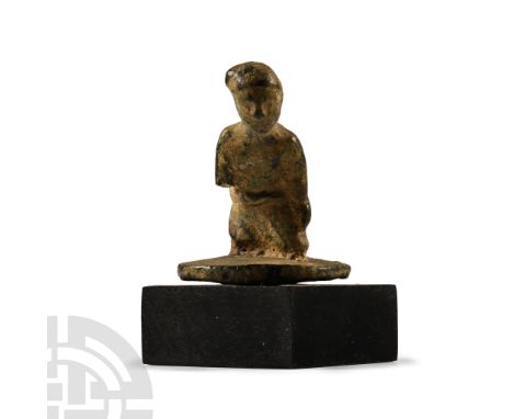 Late 2nd century A.D. Modelled in the round in kneeling pose with weight thrust forward, arms at the sides, bare-chested and 