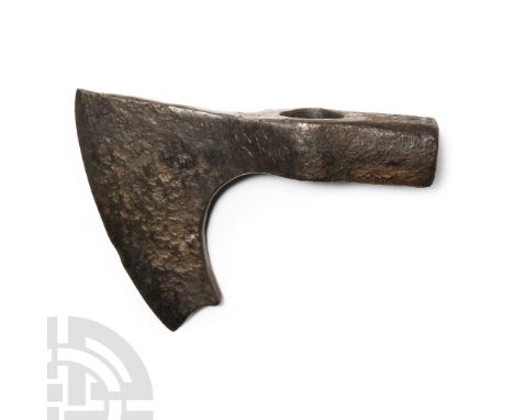 9th-11th century A.D. With broad curved blade and short spur behind the chin, narrow neck, deep socket with square-section ha