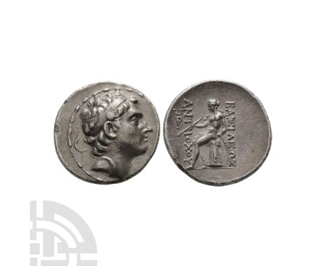 213-208 B.C. Antioch ad Orontem mint. Obv: diademed head right. Rev: BASILEWS ANTIOXOY, Apollo seated left on omphalos, testi
