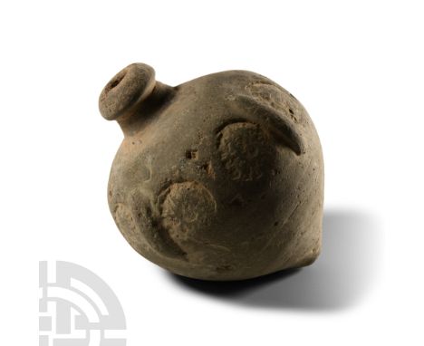 9th-11th century A.D. Piriform body with band of impressed roundels to the equator, domed filler-hole, intended to be filled 