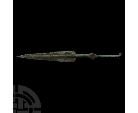 12th-11th century B.C. With heavily ridged and tapering blade, short collared shaft and a square-section tapering tang bent a