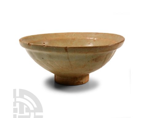 Tang Dynasty, 618-907 A.D. Broad and rounded in profile with carinated flange to the rim, basal ring.  345 grams, 17 cm wide 