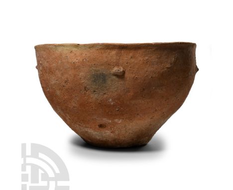 Early Bronze Age I, 3rd millennium B.C. Of hemispherical profile with everted rim, five radiating ledge handles to the should