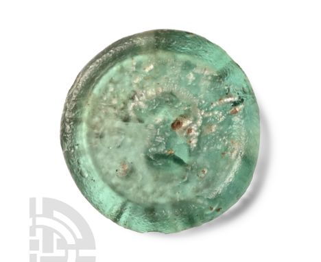 Circa 6th-8th century A.D. Discoid weight with low-relief portrait bust, Greek legend.  2.36 grams, 23 mm (7/8 in.). From the